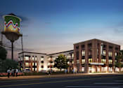 Thumbnail 3 of 33 - a rendering of a brick building with a water tower at Link Apartments® Broad Ave, Memphis