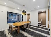 Thumbnail 33 of 33 - a dining room with a wooden table and chairs at Link Apartments® Broad Ave, Tennessee