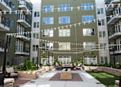 Thumbnail 10 of 24 - Courtyard With Patio at Link Apartments® Glenwood South, Raleigh, NC