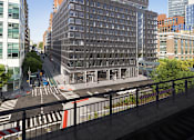 Thumbnail 1 of 34 - a rendering of a tall building with many windows and a train track in front of it