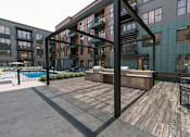 Thumbnail 25 of 33 - Gas grills at large pool courtyard at Link Apartments® Broad Ave near Kordova in Memphis, TN.
