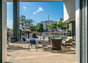 Thumbnail 14 of 24 - Poolside Lounge Area at Link Apartments® Glenwood South, North Carolina