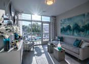 Thumbnail 2 of 24 - Living Room With Expansive Window at Link Apartments® Glenwood South, North Carolina, 27603