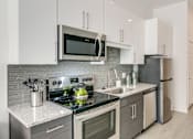 Thumbnail 7 of 29 - Kitchen area at Link Apartments® Grant Park, Atlanta, GA, 30312