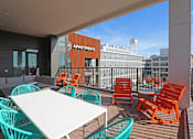 Thumbnail 10 of 44 - Rooftop Terrace Seating at Link Apartments Innovation Quarter, Winston Salem, NC, 27101