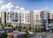 Thumbnail 1 of 25 - a rendering of an apartment complex on a city street at Link Apartments® Mint Street, North Carolina