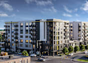 Thumbnail 2 of 25 - a rendering of an apartment building with a blue sky in the background at Link Apartments® Mint Street, Charlotte, NC, 28203