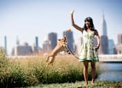 Thumbnail 32 of 34 - a girl in a green dress with a yellow dog on a leash and an orange in her