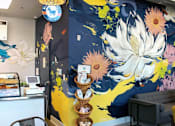 Thumbnail 2 of 37 - a mural of flowers on a blue and yellow background at Link Apartments® Canvas, Atlanta, GA