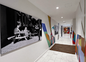 Thumbnail 28 of 32 - View Down a Hallway and Colorful Mural Art on the  at Link Apartments 4th Street in Winston-Salem, North Carolina
