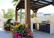 Thumbnail 20 of 33 - Poolside kitchen with grills at Link Apartments® Mixson, North Charleston, SC
