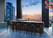 Thumbnail 16 of 34 - A bar with a view of the city skyline at dusk.