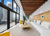 Thumbnail 26 of 39 - A modern room with a large window overlooking the city at Link Apartments® QPN, Long Island City, New York