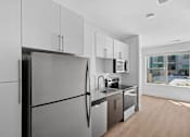 Thumbnail 10 of 22 - Modern kitchen with stainless steel appliances1 at Link ® Lake Park Apartments, Georgia, 30080
