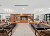 Thumbnail 22 of 22 - Spacious resident lounge with fireplace and seating at Link ® Lake Park Apartments, Smyrna