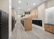 Thumbnail 17 of 22 - Mail room with package lockers and pendant lighting at Link ® Lake Park Apartments, Smyrna, GA 30080