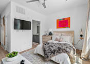 Thumbnail 15 of 22 - Bedroom with ensuite bathroom and ceiling fan at Link ® Lake Park Apartments, Georgia, 30080
