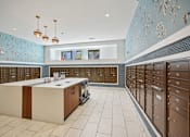 Thumbnail 32 of 32 - the locker room at the gym with lockers and counters and blue wallpaper at Link Apartments® 4th Street, North Carolina