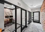 Thumbnail 6 of 22 - Modern conference room with glass partition doors at Link ® Lake Park Apartments, Smyrna, GA 30080