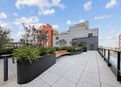 Thumbnail 35 of 39 - A modern building with a flat roof and a planter box at Link Apartments® QPN, Long Island City, New York