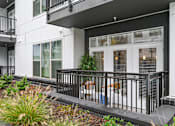 Thumbnail 16 of 25 - the front of a building with windows and a balcony at Link Apartments® Mint Street, Charlotte, North Carolina