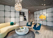 Thumbnail 3 of 25 - a living room with a couch and chairs and a coffee table at Link Apartments® Mint Street, Charlotte, NC, 28203