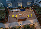 Thumbnail 11 of 25 - an aerial view of a patio with chairs and lights