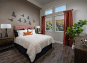 Thumbnail 4 of 25 - a bedroom with a bed and birds on the wall