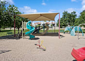 Thumbnail 23 of 26 - a playground with slides and a tent