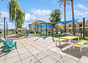 Thumbnail 22 of 24 - a large patio with picnic tables and chairs at Biscayne Bay