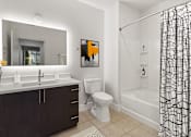 Thumbnail 5 of 15 - a bathroom with a shower toilet and a sink