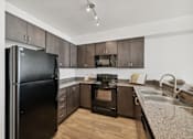Thumbnail 4 of 19 - Kitchen at Maddox Apartments