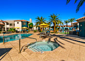 Thumbnail 23 of 33 - Pool side at Sonoran Apartment Homesbuildings in the background