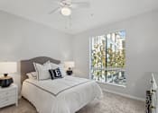 Thumbnail 4 of 20 - Spacious bedroom with a large window