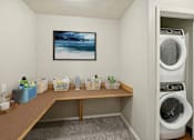 Thumbnail 6 of 16 - a washer and dryer in a laundry room with a desk and a washing