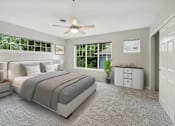 Thumbnail 3 of 16 - a bedroom with a bed and a ceiling fan