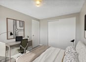 Thumbnail 6 of 10 - a bedroom with a bed and a desk with a computer