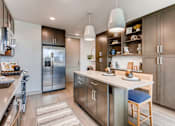 Thumbnail 2 of 21 - Furnished Island Kitchen at The Rylan Apartments