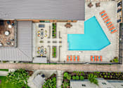Thumbnail 29 of 31 - A modern house with a pool and a garden.