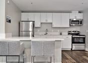Thumbnail 17 of 22 - Gourmet Kitchen With Island at Del Norte Place Apartment Homes, El Cerrito, California