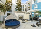 Thumbnail 8 of 20 - Exterior Fireplace and Lounge at Enclave at Warner Center, 6710 Variel Ave