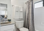 Thumbnail 8 of 23 - Bathroom at The District Apartment Homes