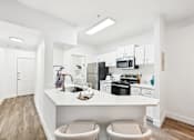 Thumbnail 4 of 34 - barstools at white kitchen counter