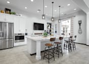 Thumbnail 12 of 24 - Kitchen Area In Clubhouse at Mitchell Place Apartments, California, 92562