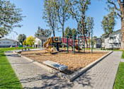 Thumbnail 18 of 23 - Playground at The District Apartment Homes