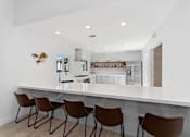 Thumbnail 22 of 24 - clubhouse with full kitchen at Pointe Luxe Apartment Homes, San Diego, CA, 92110