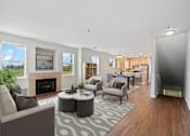 Thumbnail 2 of 16 - a living room with couches and chairs and a fireplace