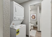 Thumbnail 11 of 21 - an empty laundry room with a washer and dryer in it