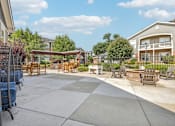 Thumbnail 15 of 31 - A sunny day at a residential outdoor patio area.