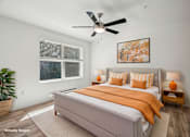 Thumbnail 10 of 27 - A bedroom with a bed, a ceiling fan, and a painting on the wall.